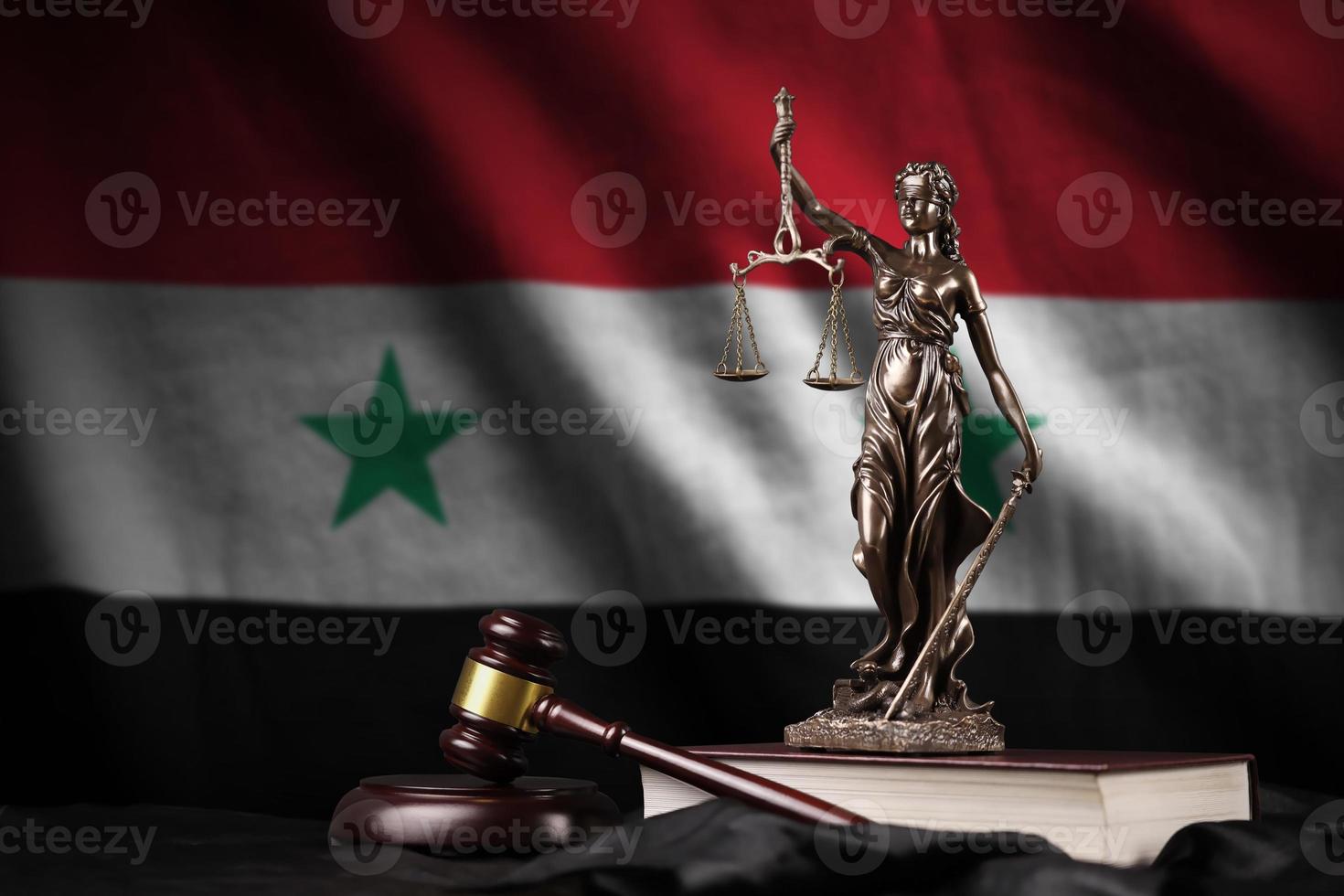 Syria flag with statue of lady justice, constitution and judge hammer on black drapery. Concept of judgement and guilt photo