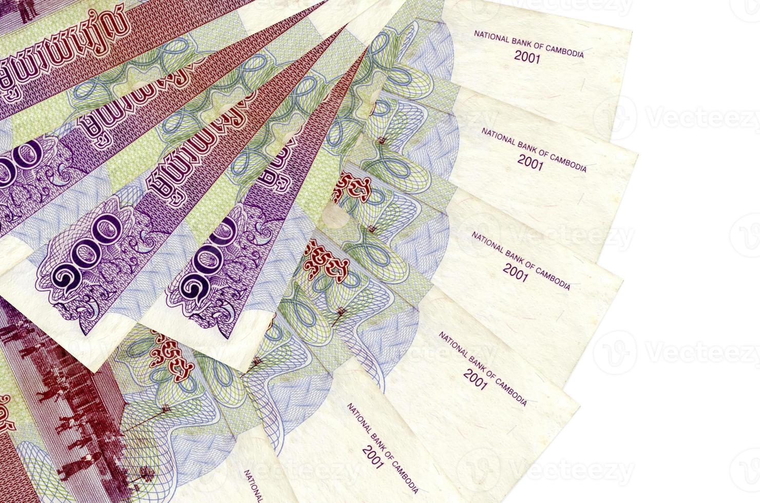 100 Cambodian riels bills lies isolated on white background with copy space stacked in fan shape close up photo
