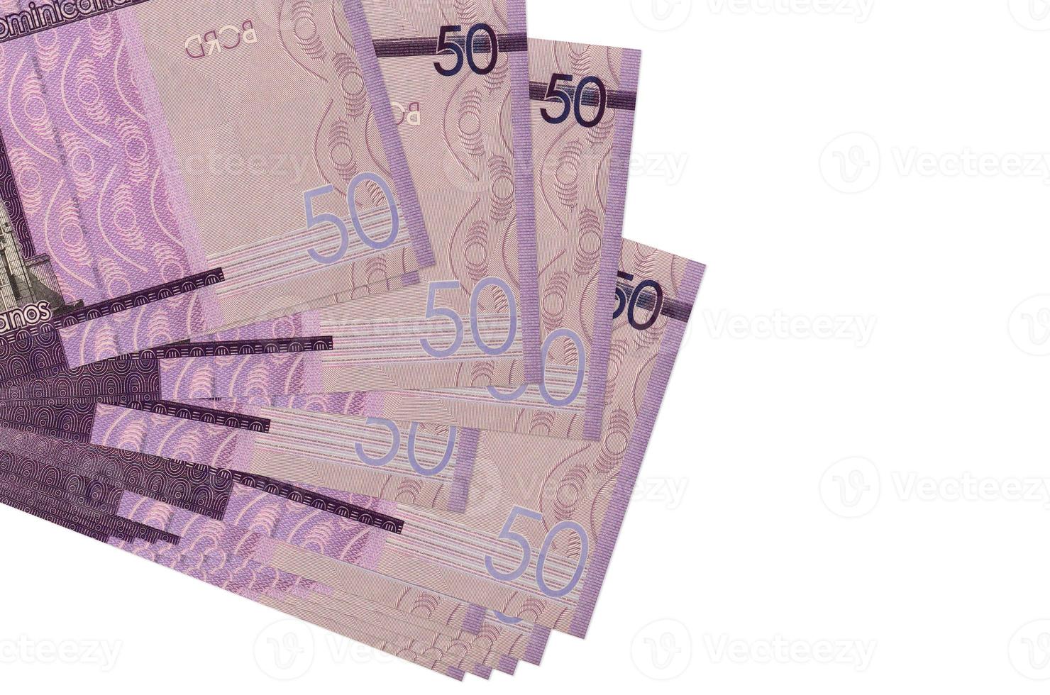 50 Dominican pesos bills lies in small bunch or pack isolated on white. Mockup with copy space. Business and currency exchange photo