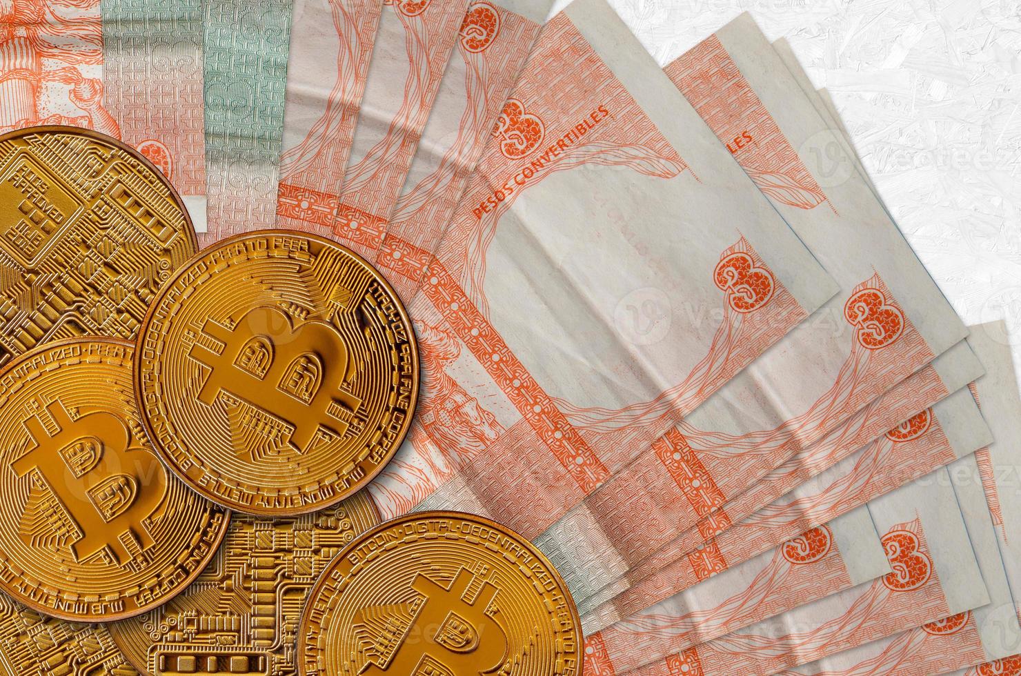 3 cuban pesos convertibles bills and golden bitcoins. Cryptocurrency investment concept. Crypto mining or trading photo