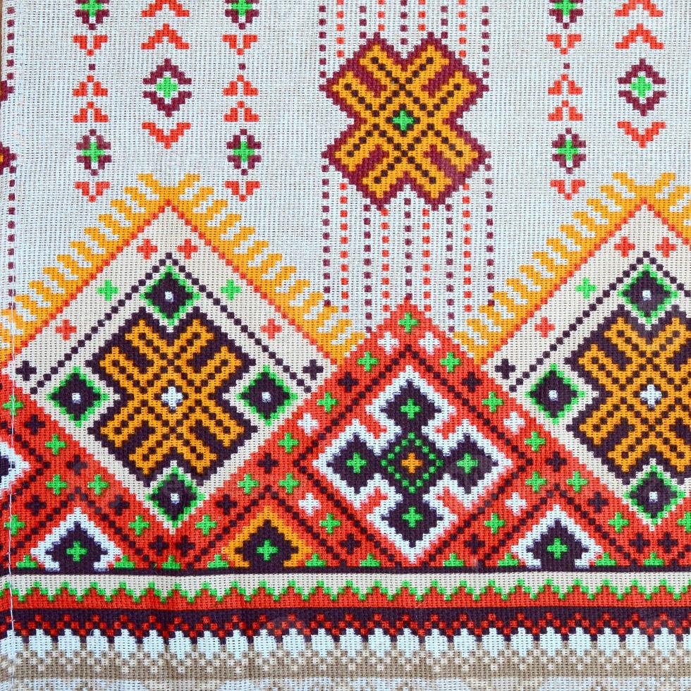 Traditional Ukrainian folk art knitted embroidery pattern on textile fabric photo