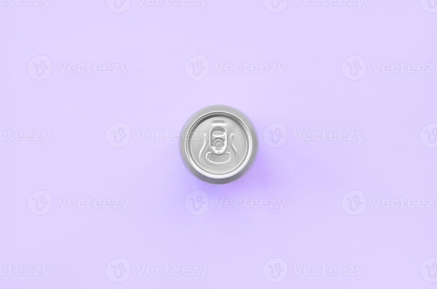 Metallic beer can on texture background of fashion pastel violet color paper in minimal concept photo