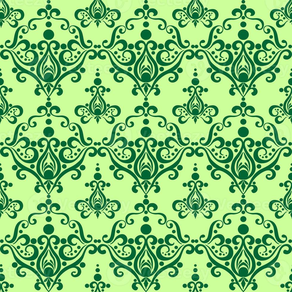 symmetrical seamless ornament tile from green graphic abstract elements on olive background, texture, design photo
