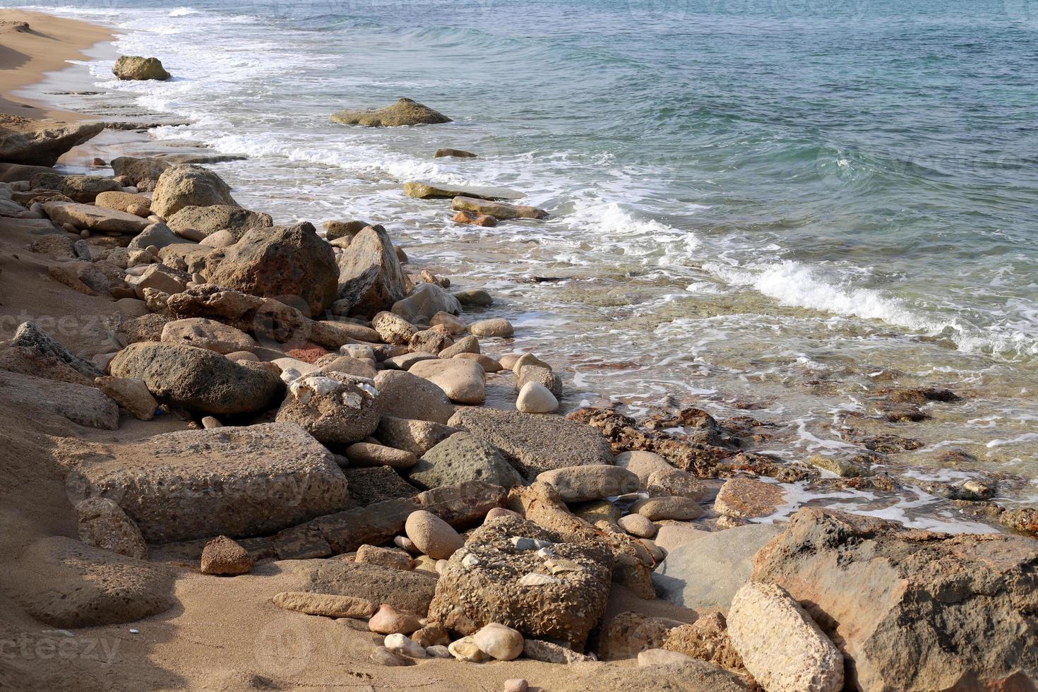 Stones on the shore of the Mediterranean Sea. photo