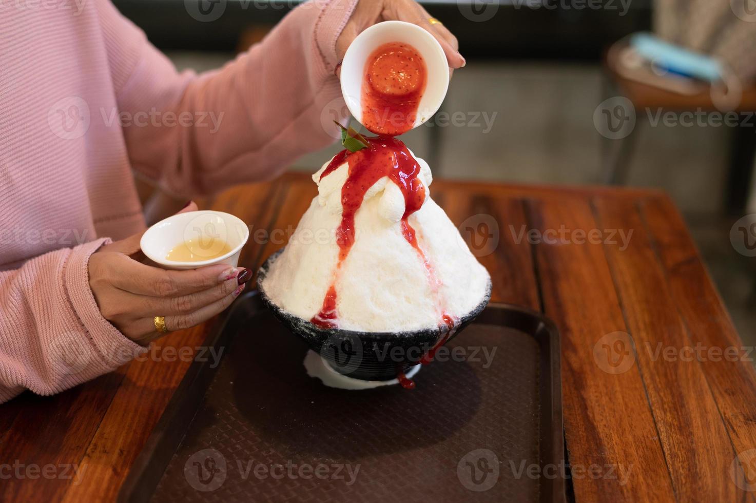 Korean shaved ice dessert with sweet toppings, Strawberry Bingsu on