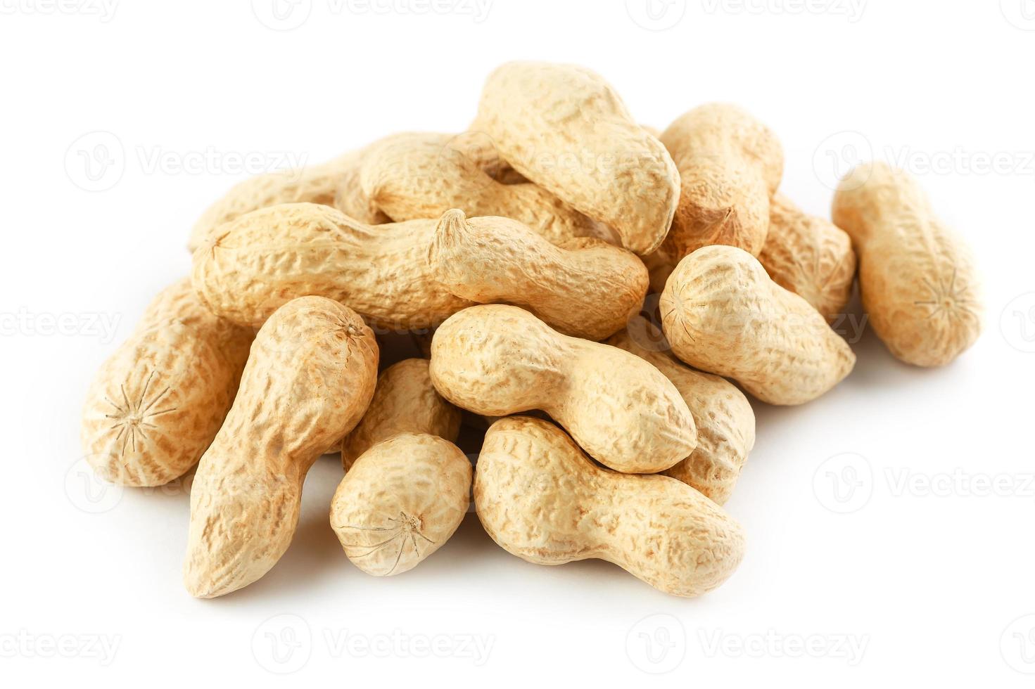 Peanuts. Two peeled nuts isolated on white background. Peanut macro. photo