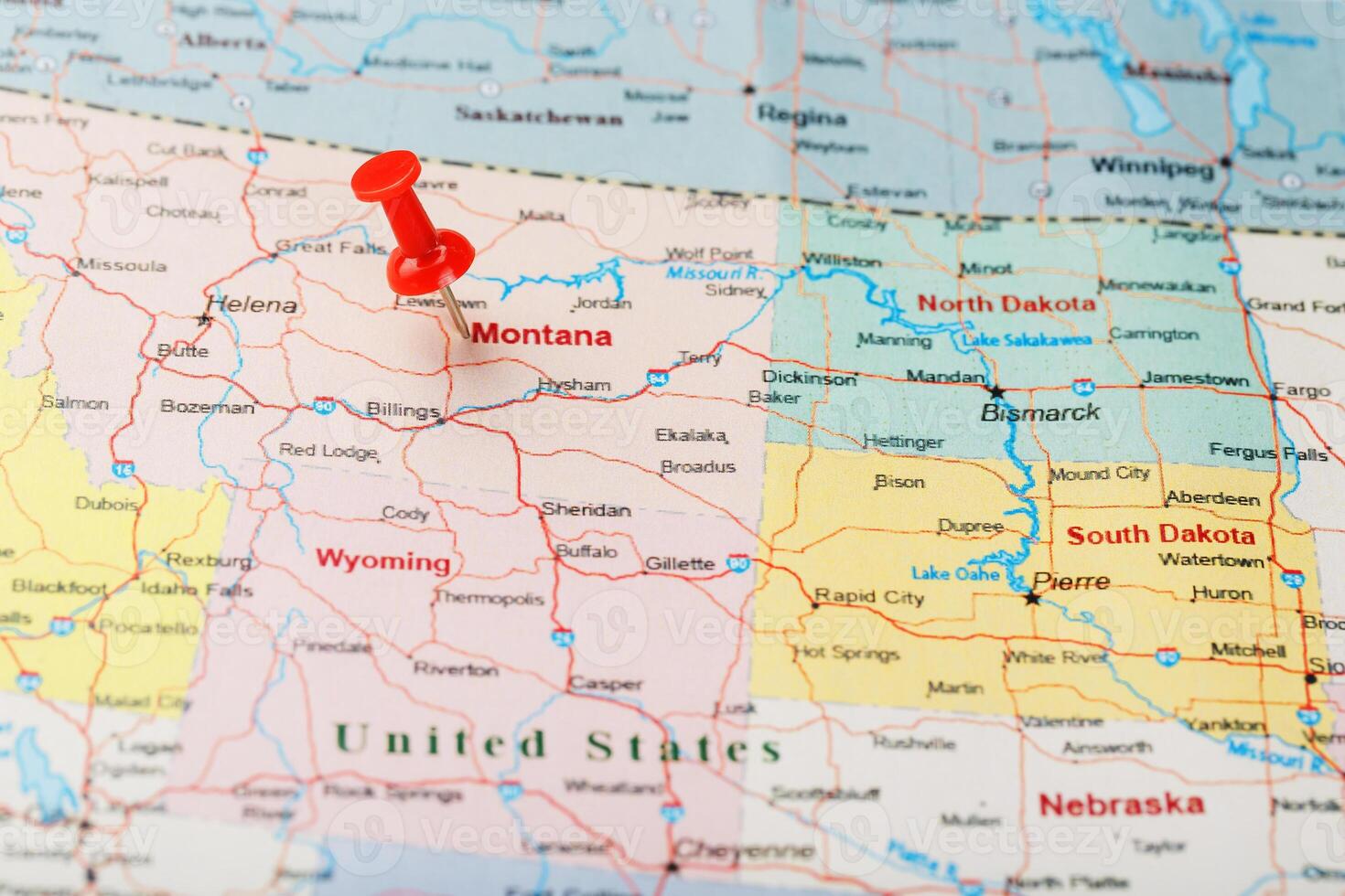 Red clerical needle on a map of - Red Clerical Needle On A Map Of Usa Montana And The Capital Of Helena Close Up Montana Map With Red Tack Photo 