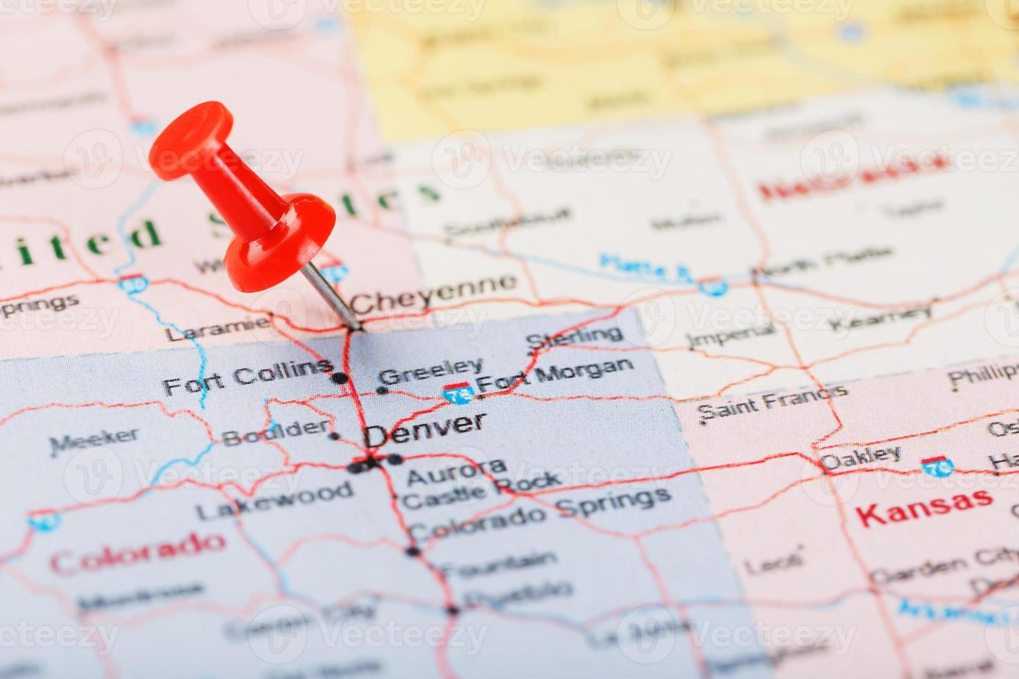 Red clerical needle on a map of United States, Wyoming and the capital Cheyenne. Close up map of wyoming with red tack, US map pin photo