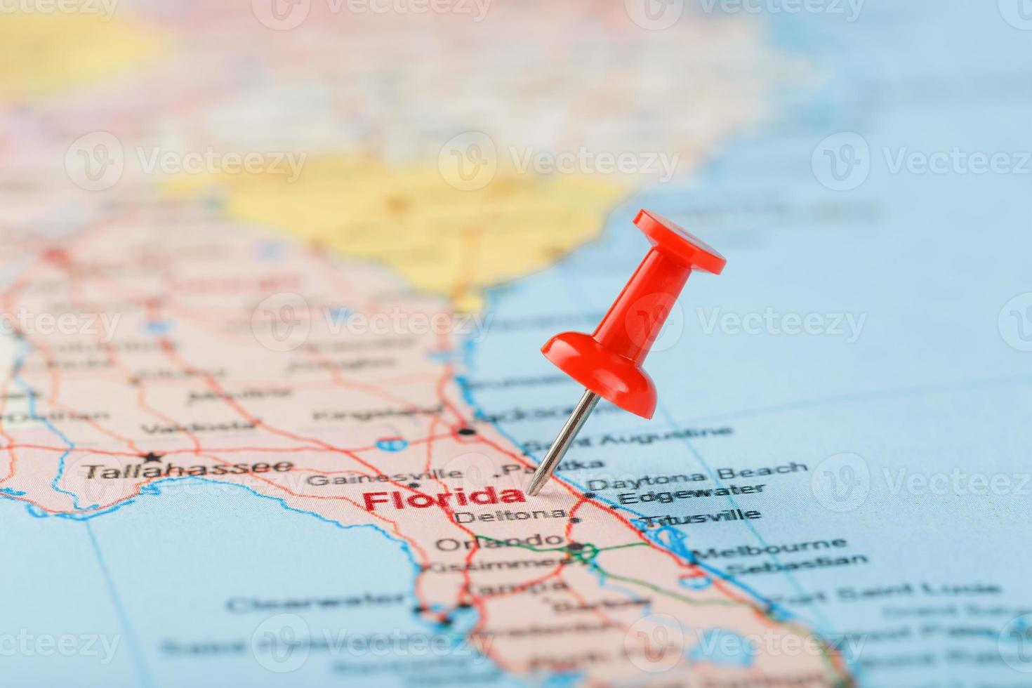 Red clerical needle on a map of USA, South Florida and the capital Tallahassee. Close up map of South Florida with red tack photo