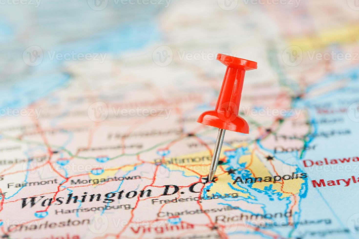 Red clerical needle on the map of USA, South Washington, DC and the capital of Richmond. Close up map of DC with red tack photo