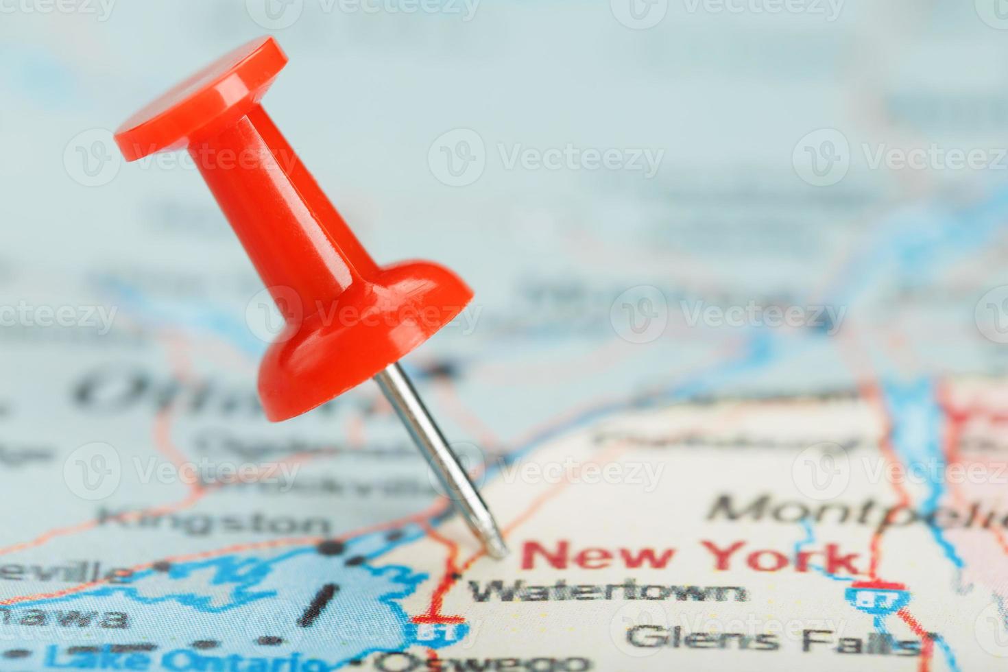 Red clerical needle on a map of USA, South New York and the capital Albany. Close up map of South New York with red tack photo