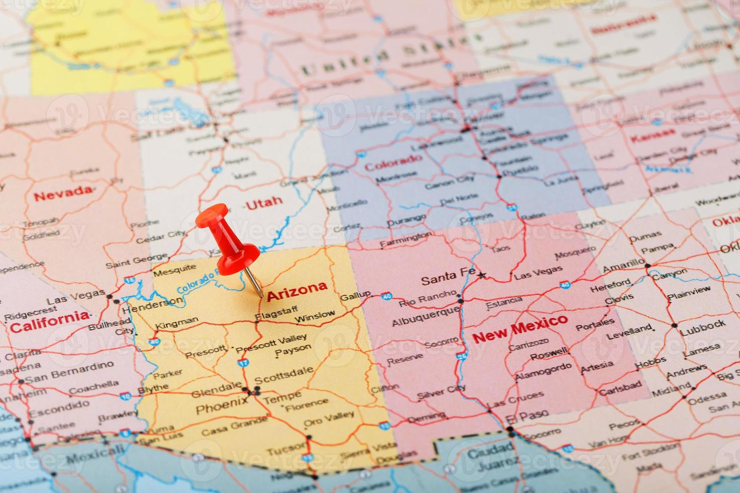 Red clerical needle on a map of USA, Arizona and the capital Phoenix. Closeup Map Arizona with Red Tack photo