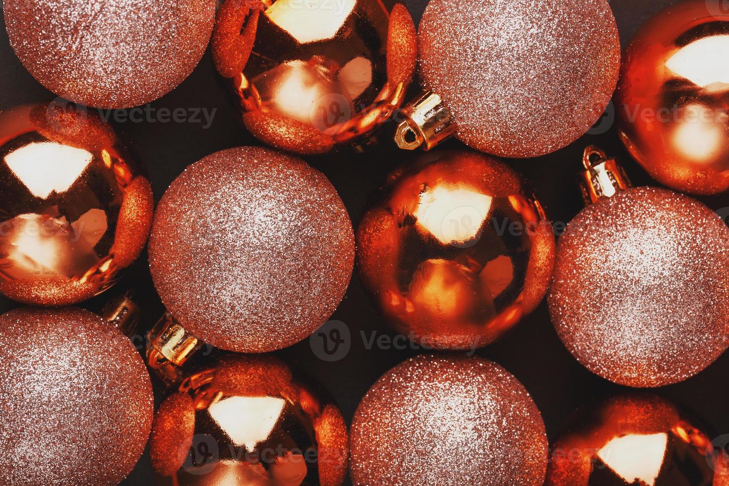 Golden Christmas balls close up as background. Full screen, photo