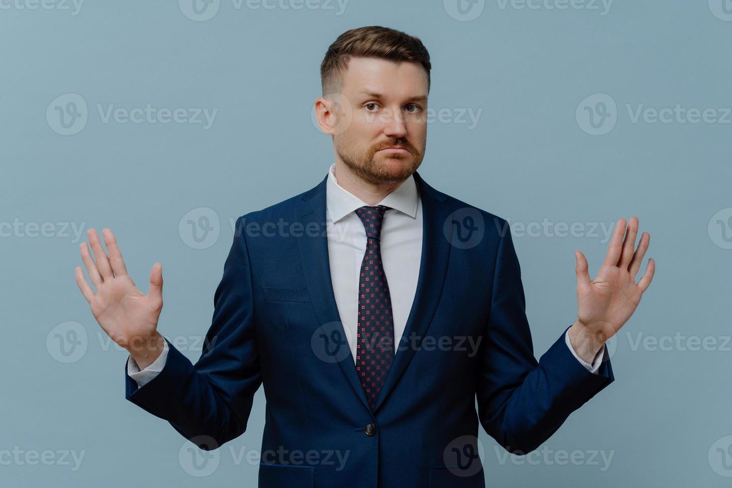 Confident businessman saying strict NO while rejecting offer photo