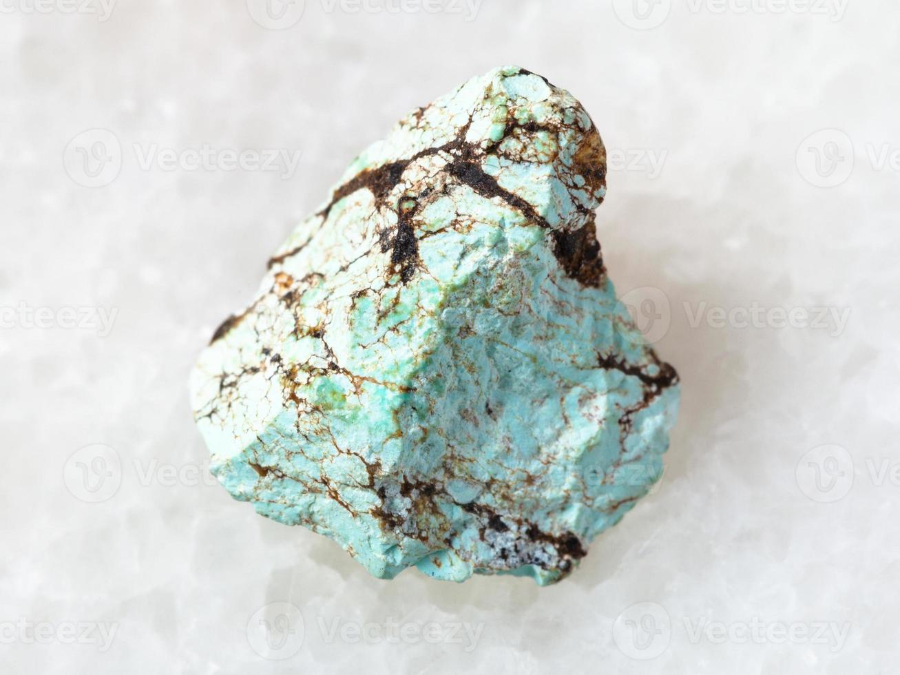 raw green Turquoise gemstone on white photo