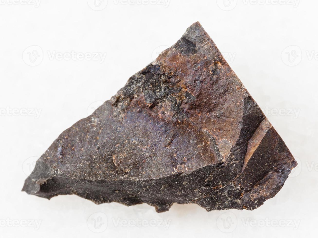 rough tagamite stone on white photo