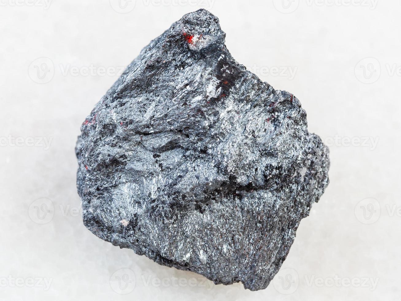 raw antimony ore Stibnite stone on white photo