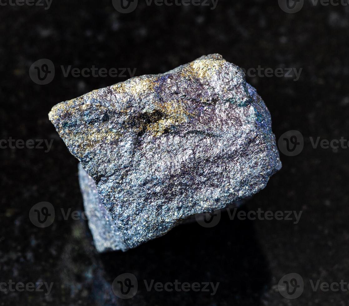 raw Bornite with Chalcopyrite rock on black photo