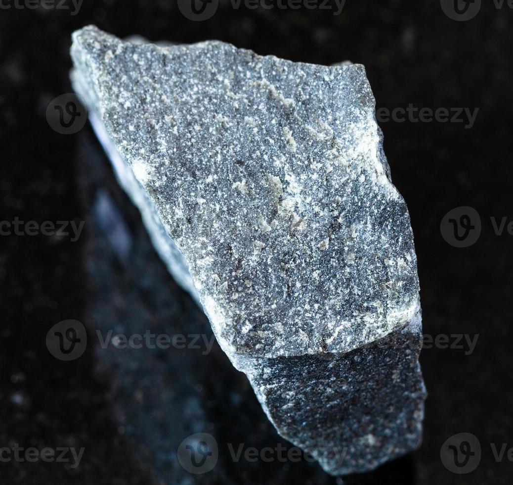 unpolished Andesite rock on black photo