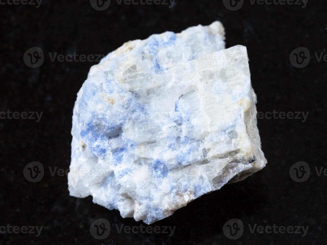raw vishnevite stone on dark background 14937652 Stock Photo at Vecteezy