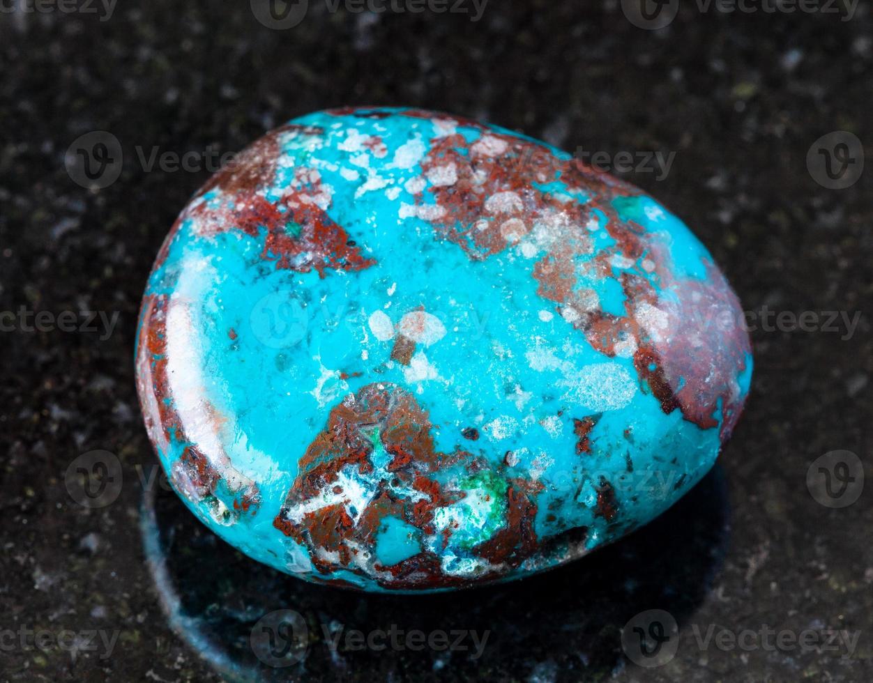 polished Chrysocolla with Cuprite rock on black photo