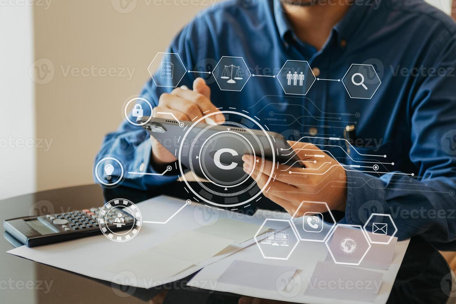 Copyright or patent concept, Person hand using laptop computer, tablet and smartphone with virtual screen copyright icon trademark, Creation ownership against piracy. photo