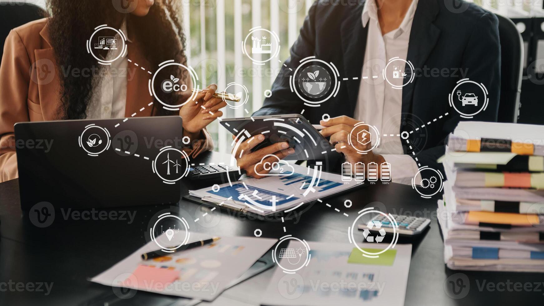Business team working virtual tablet to emissions carbon CO2 climate change to limit global warming.Sustainable development and green business concept. photo