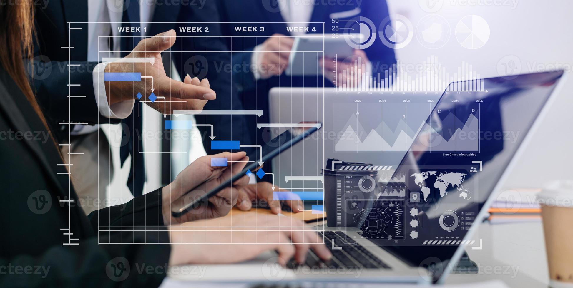 Businessman hand Project manager working and update tasks and Gantt chart scheduling virtual diagram.with smart phone, tablet and laptop in office. photo