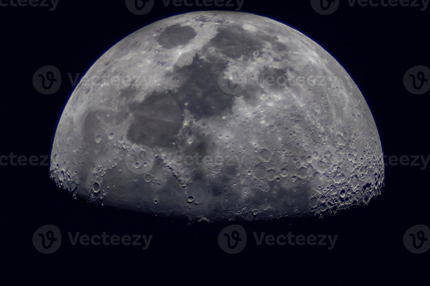 Surface of the Moon on black background, close up. photo