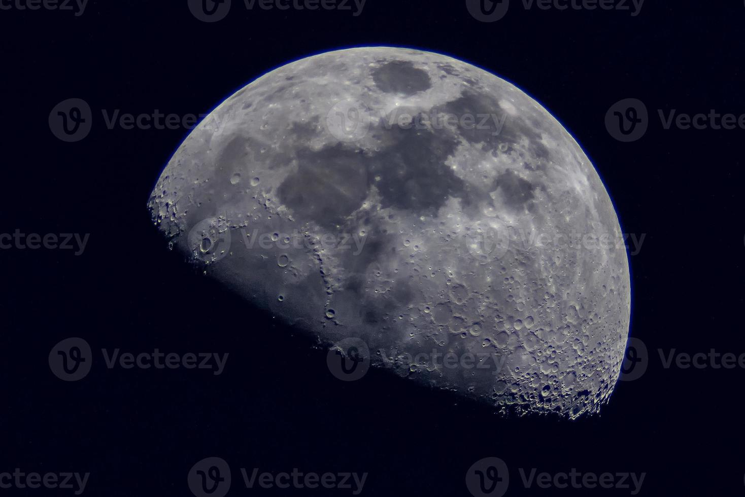 Surface of the Moon on black background, close up. photo