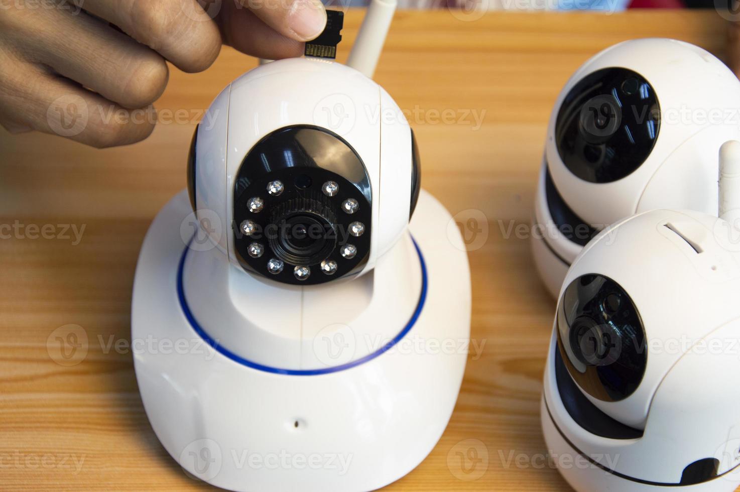 Conceptual man operating ip camera photo