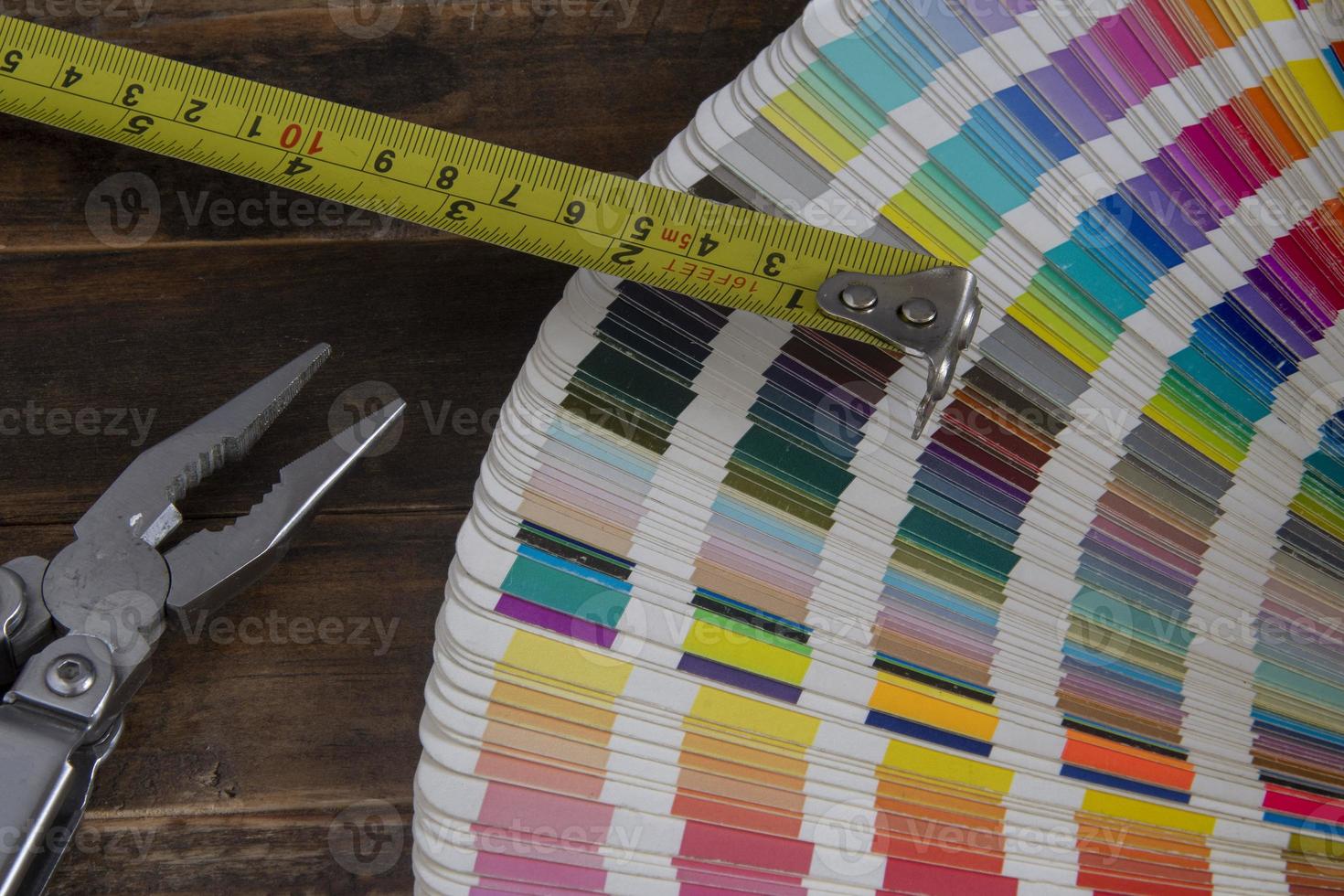 Color swatches used in graphic arts, with a measuring tape used in construction photo