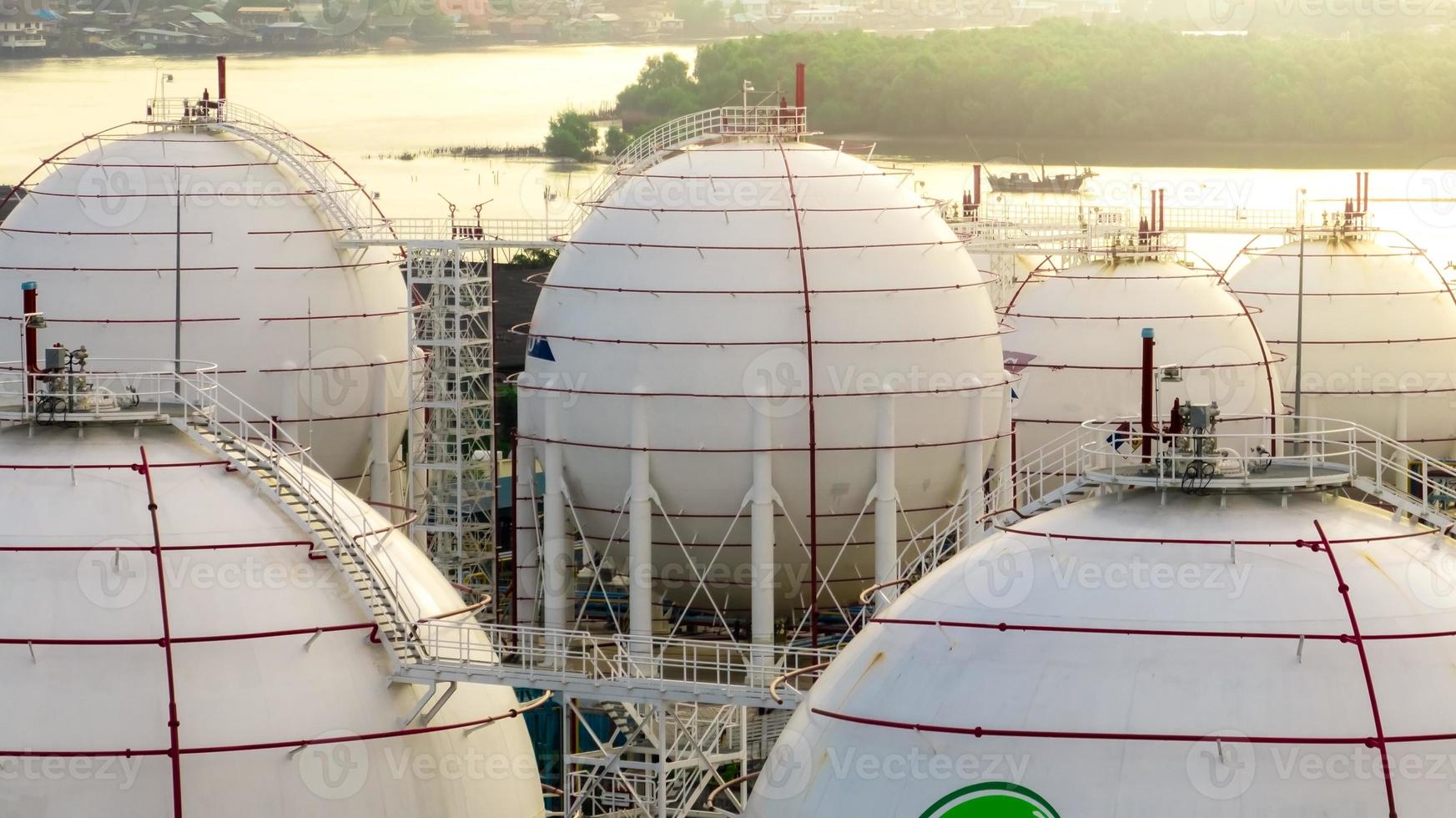 Industrial gas storage tank. LNG or liquefied natural gas storage tank. Energy price crisis. Gas tank in petroleum refinery. Energy crisis. Natural gas storage industry and global market consumption. photo