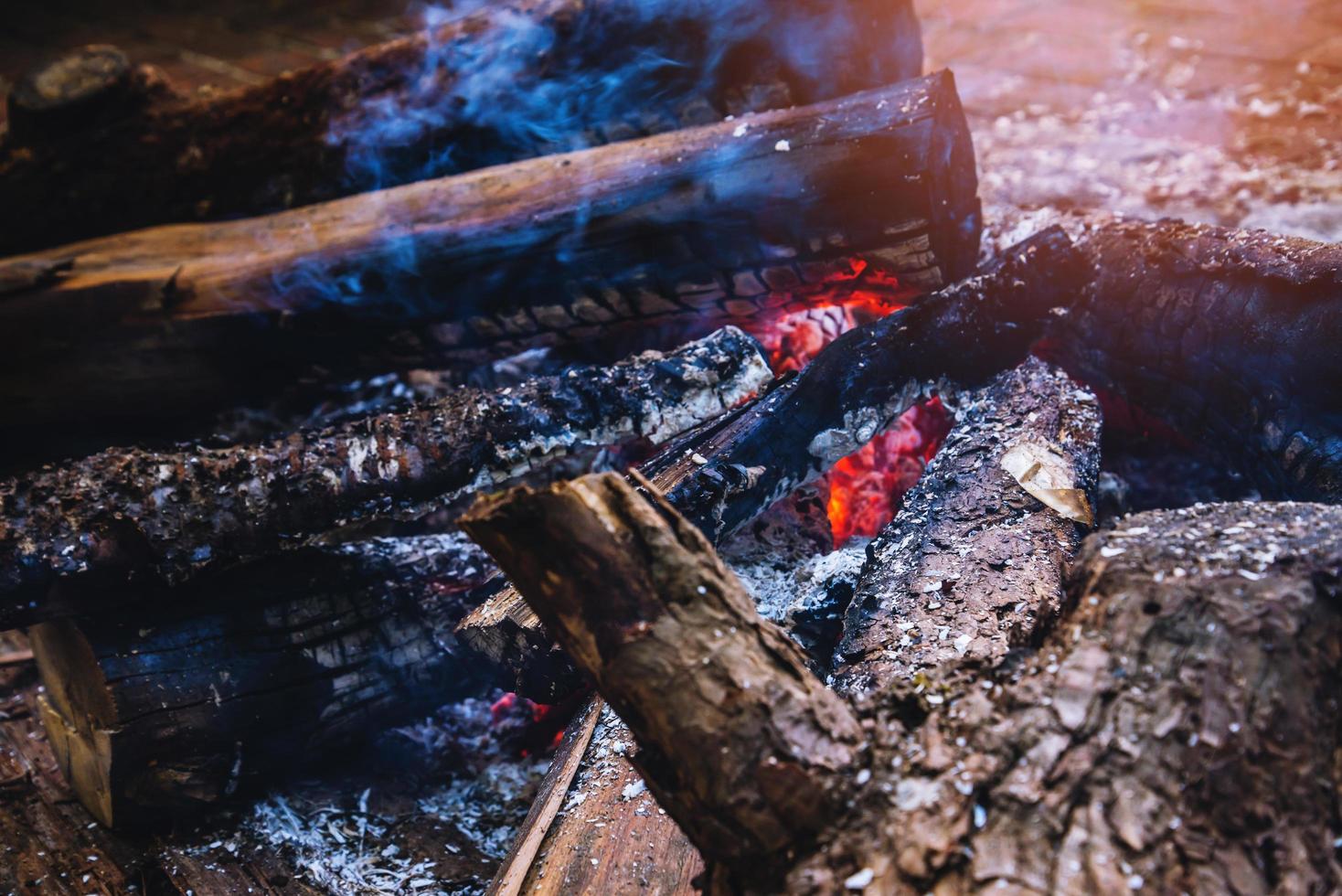 A burning bonfire fire in nature . bokeh from the fire blurred backgrounds photo