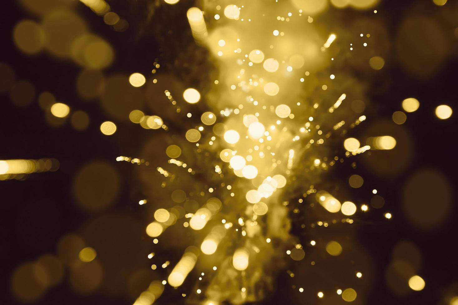 Abstract background. Gold-colored blur. Fireworks circle blur photo