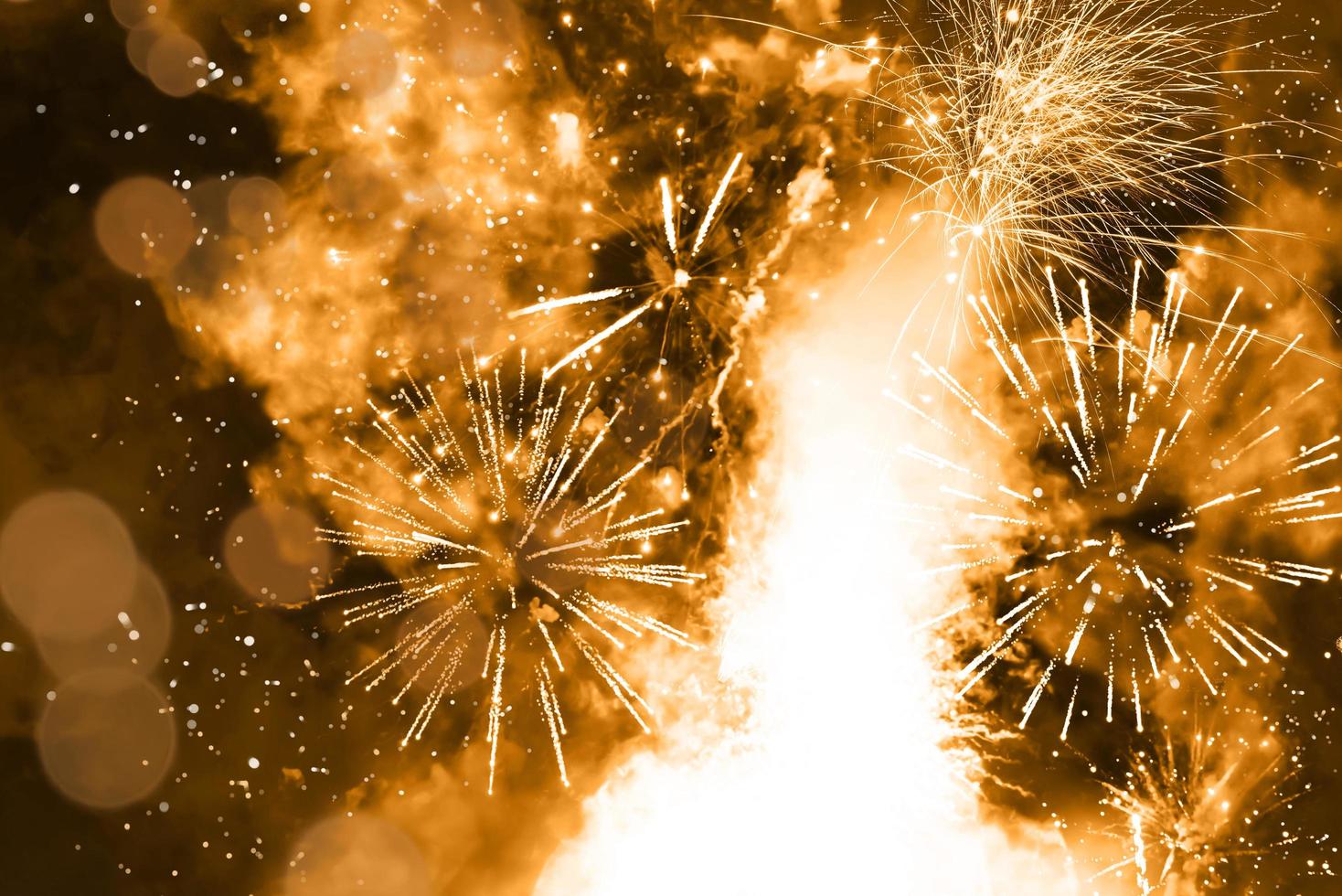 Abstract background. Gold-colored blur. Fireworks circle blur photo