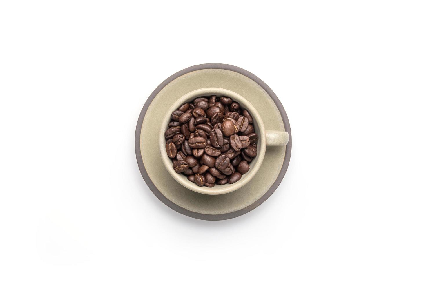 Cup and coffee beans, isolated on a white background. Full frame photo