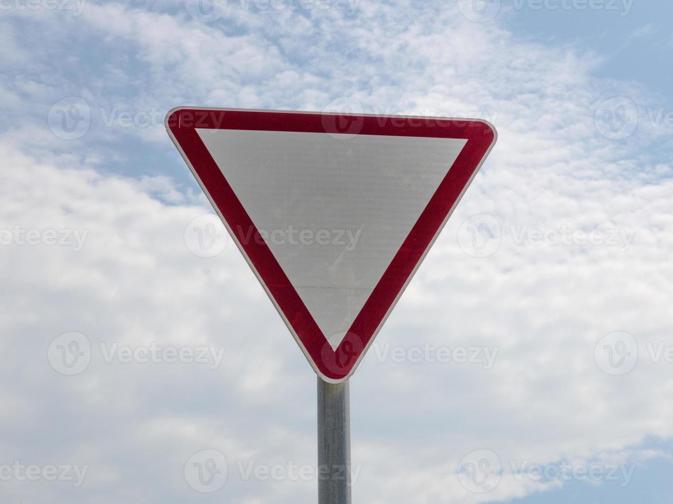 the give way sign on sky background 14940901 Stock Photo at Vecteezy