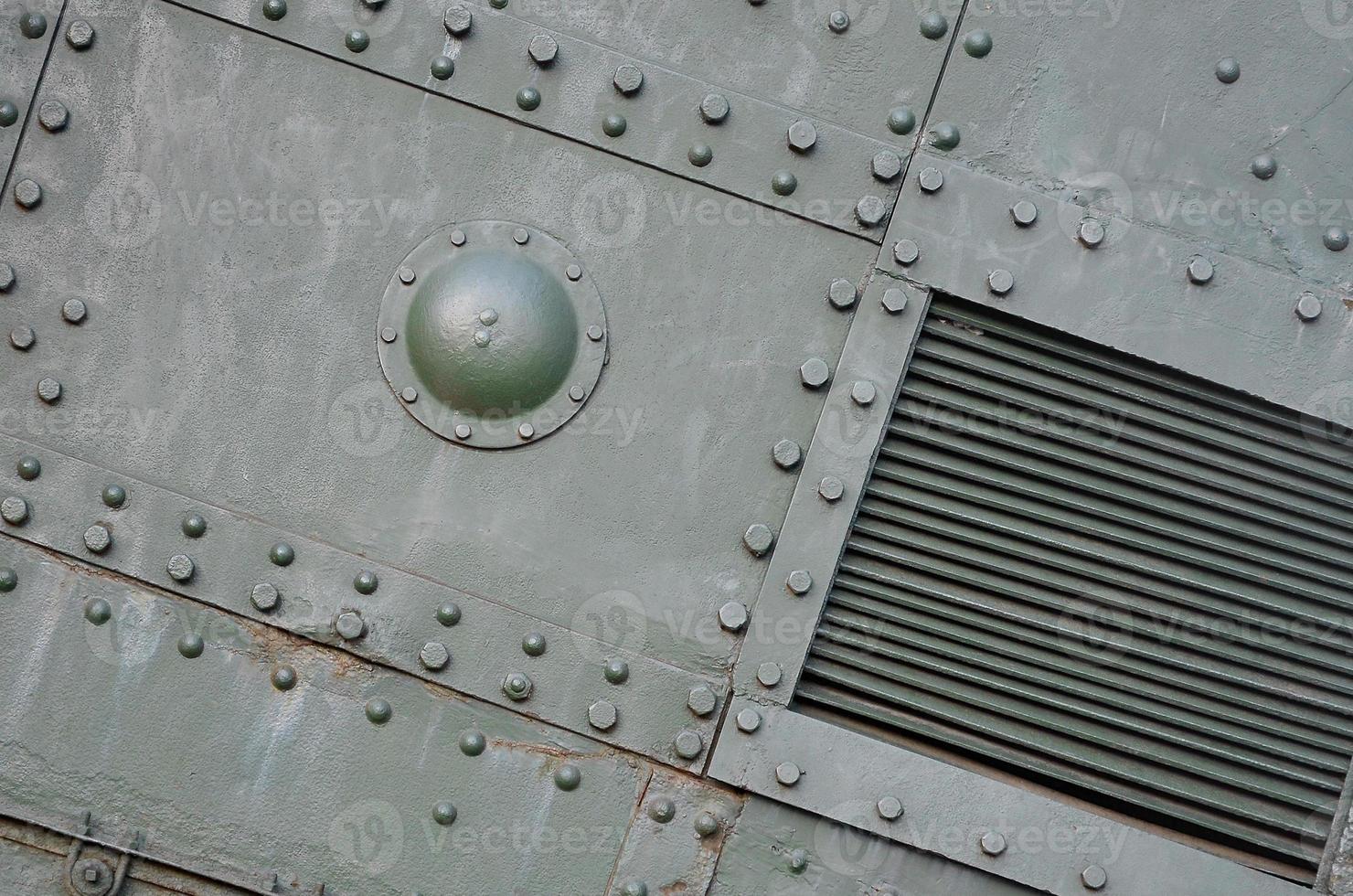 Abstract green industrial metal textured background with rivets and bolts photo
