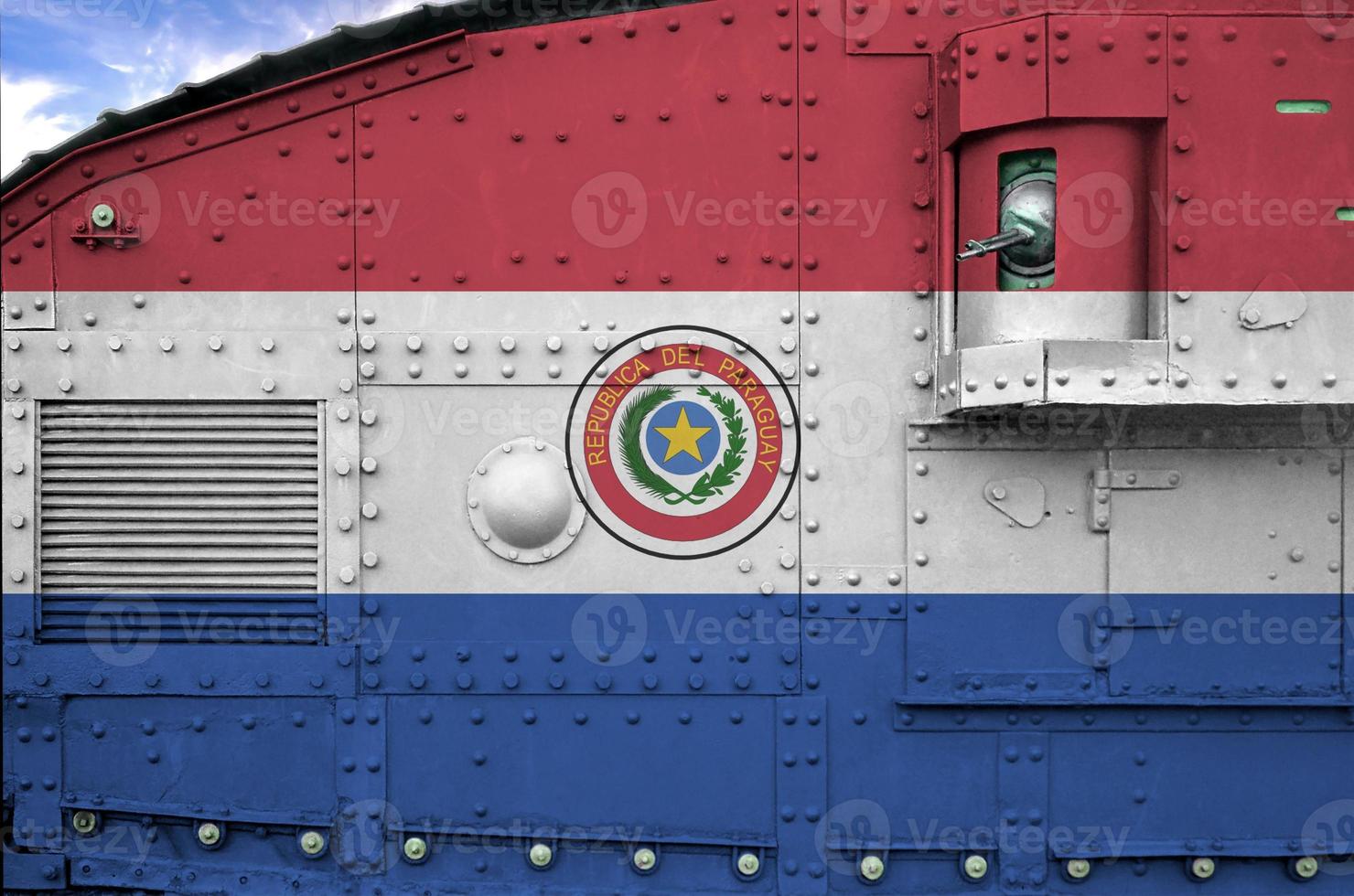Paraguay flag depicted on side part of military armored tank closeup. Army forces conceptual background photo