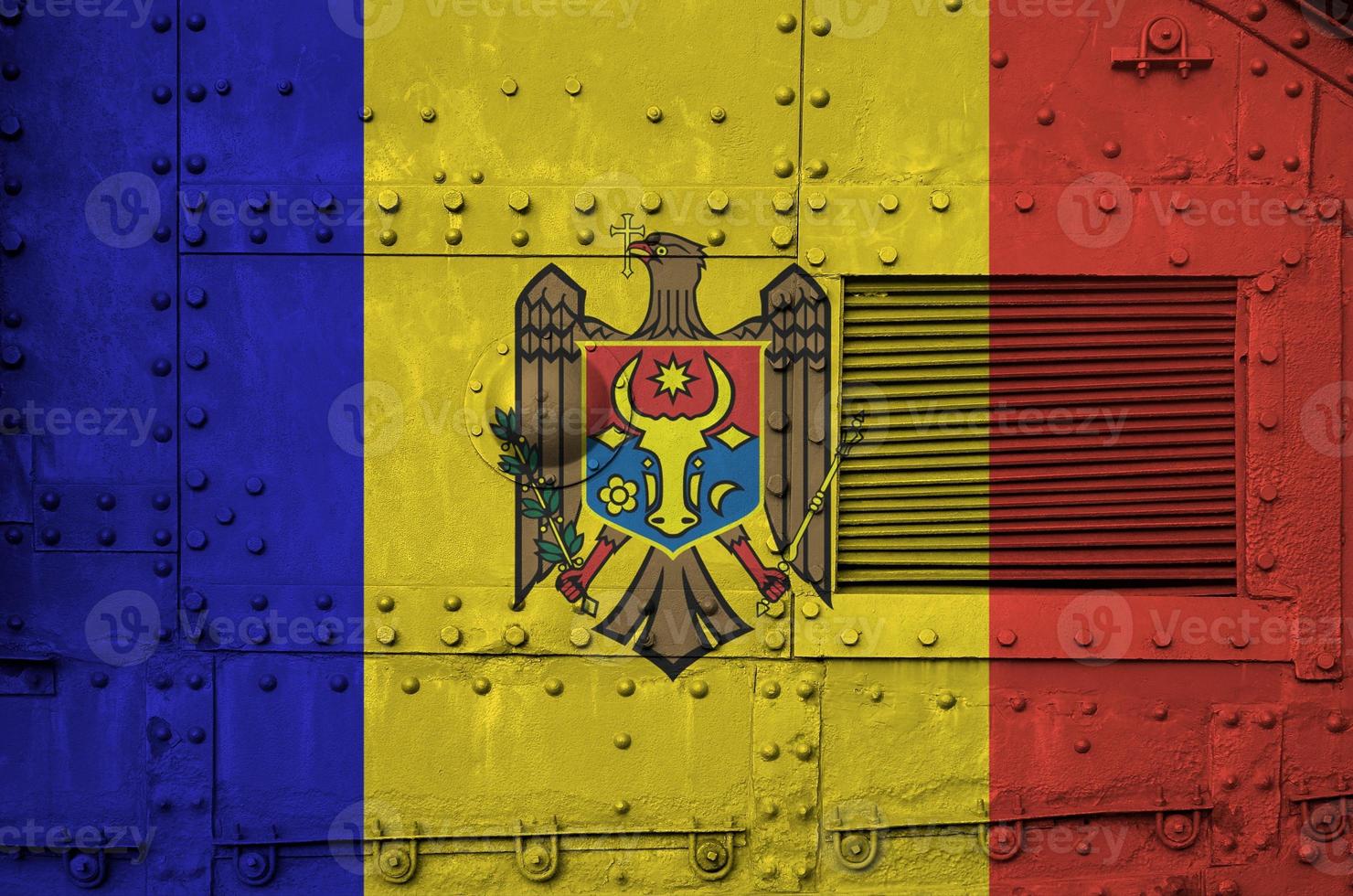 Moldova flag depicted on side part of military armored tank closeup. Army forces conceptual background photo