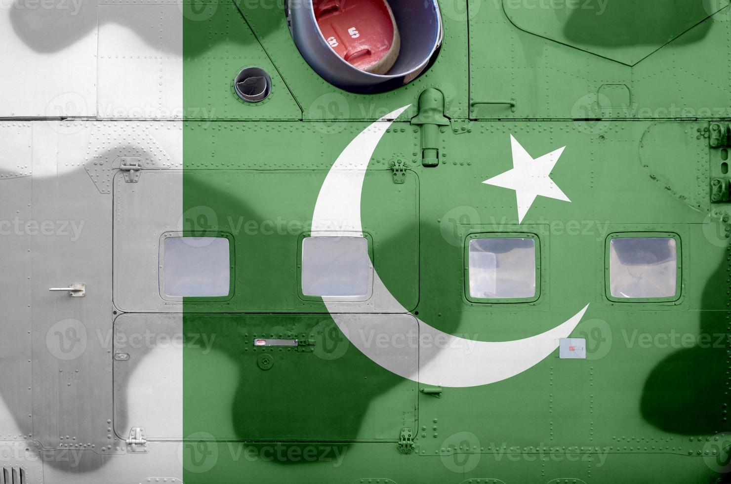Pakistan flag depicted on side part of military armored helicopter closeup. Army forces aircraft conceptual background photo