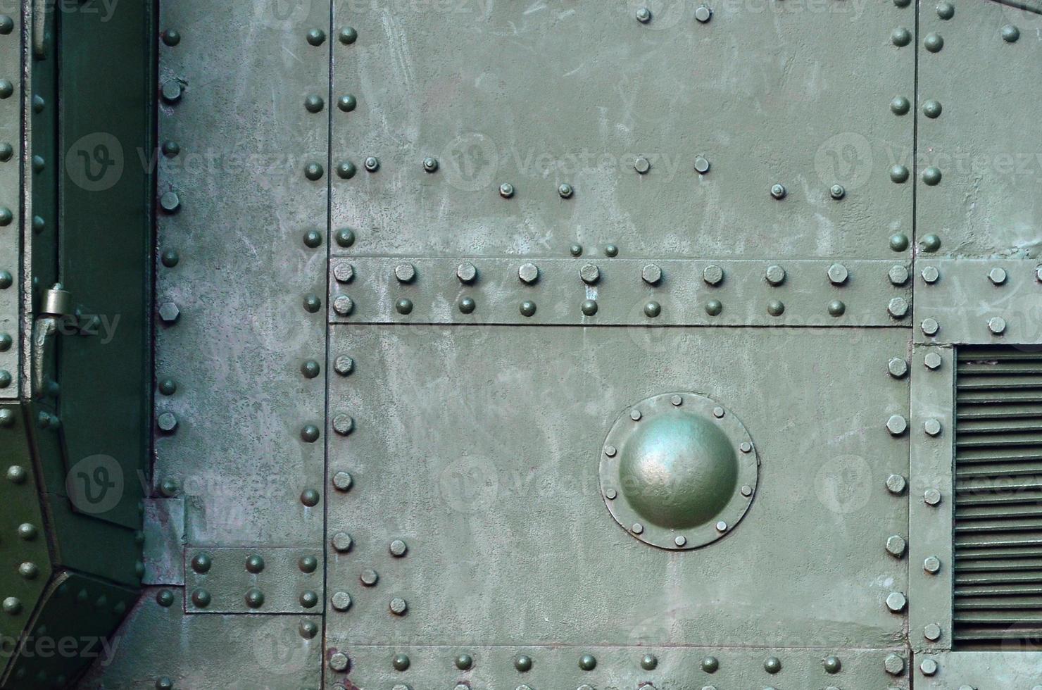 Abstract green industrial metal textured background with rivets and bolts photo