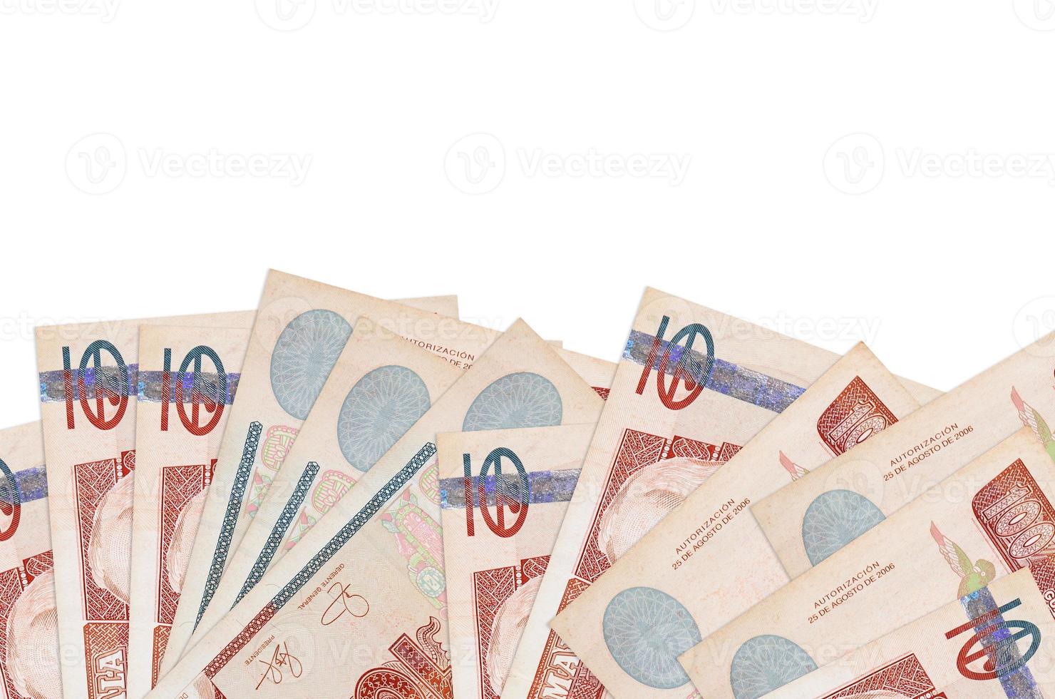 100 Guatemalan quetzales bills lies on bottom side of screen isolated on white background with copy space. Background banner template photo