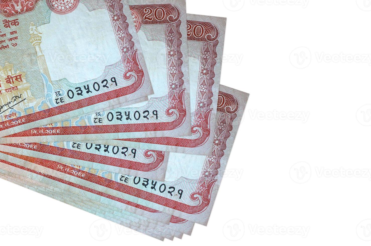 20 Nepalese rupees bills lies in small bunch or pack isolated on white. Mockup with copy space. Business and currency exchange photo
