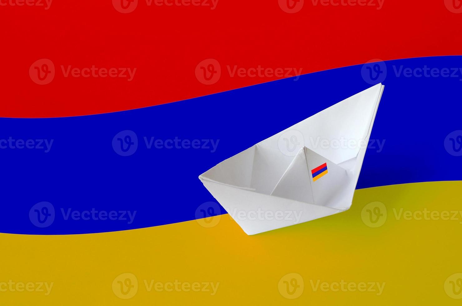 Armenia flag depicted on paper origami ship closeup. Handmade arts concept photo