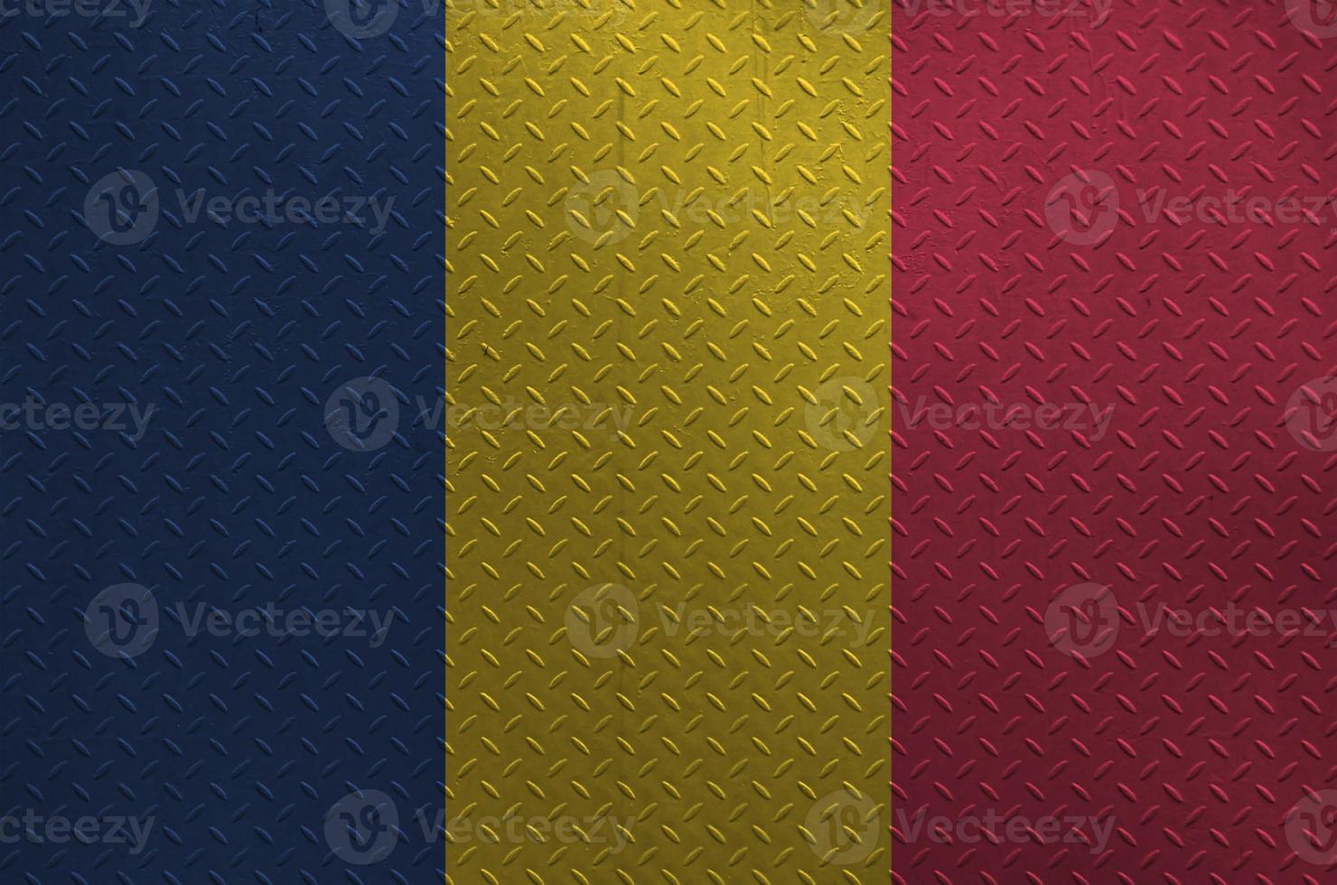 Chad flag depicted in paint colors on old brushed metal plate or wall closeup. Textured banner on rough background photo