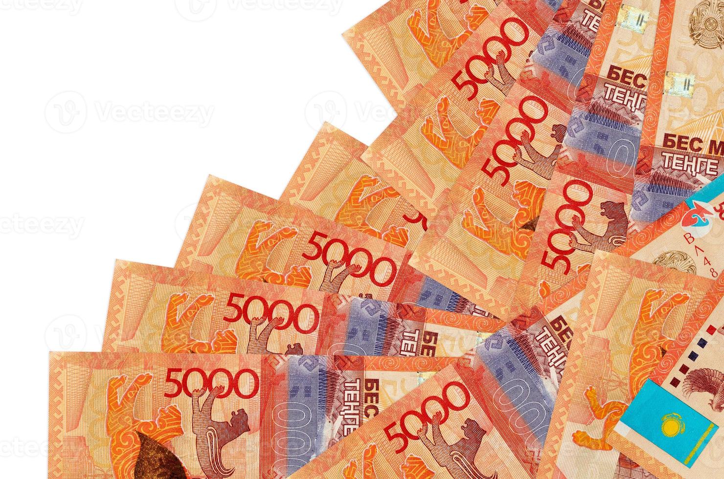 5000 Kazakhstani tenge bills lies in different order isolated on white. Local banking or money making concept photo