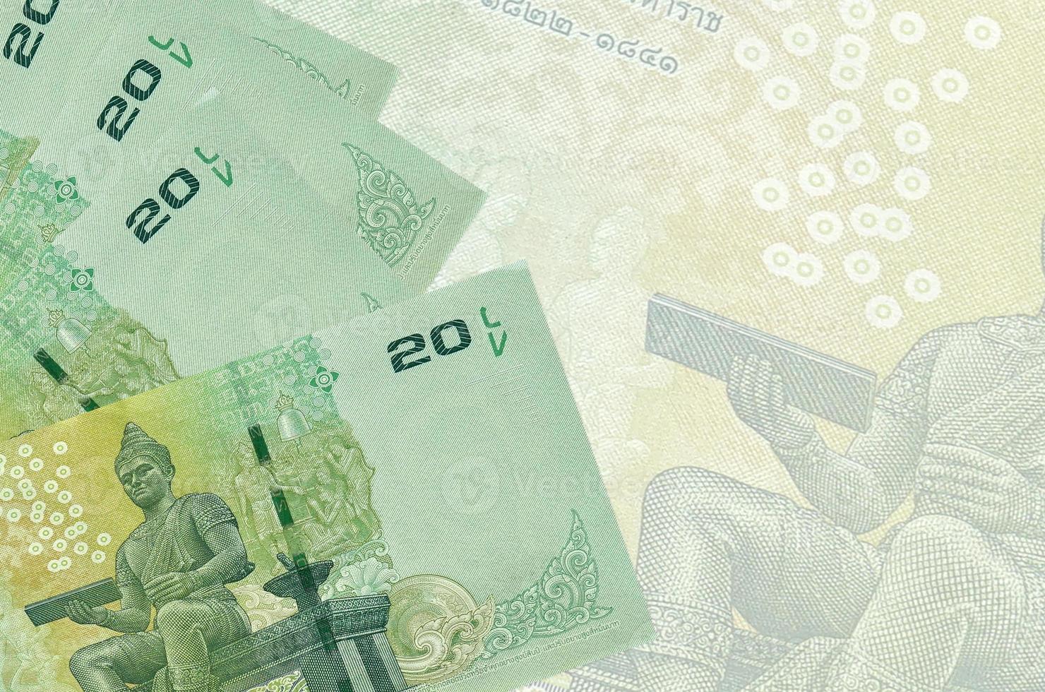 20 Thai Baht bills lies in stack on background of big semi-transparent banknote. Abstract business background photo