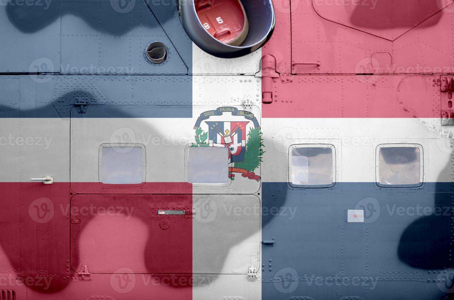 Dominican Republic flag depicted on side part of military armored helicopter closeup. Army forces aircraft conceptual background photo